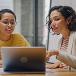 Women looking at computer