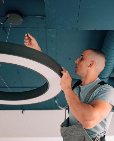 man working on light